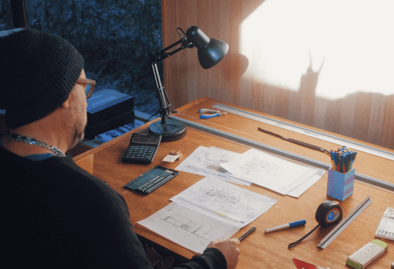 Company Investments - Man At Desk